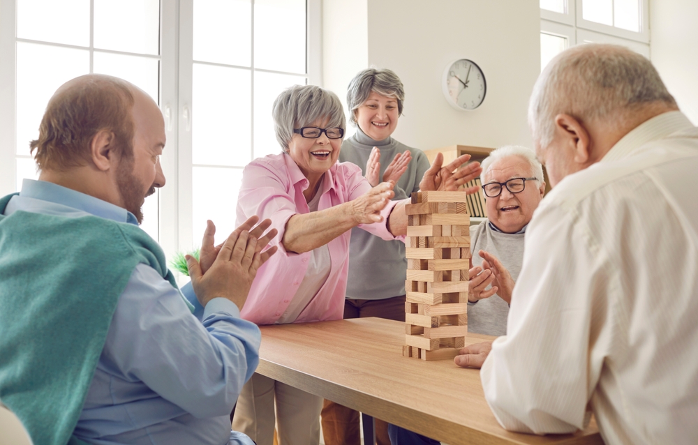 Active adults enjoying a game together in 55 Plus Communities