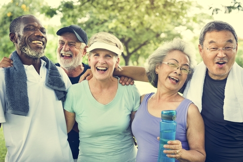 Group of active adults enjoying fitness together in 55 Plus Communities