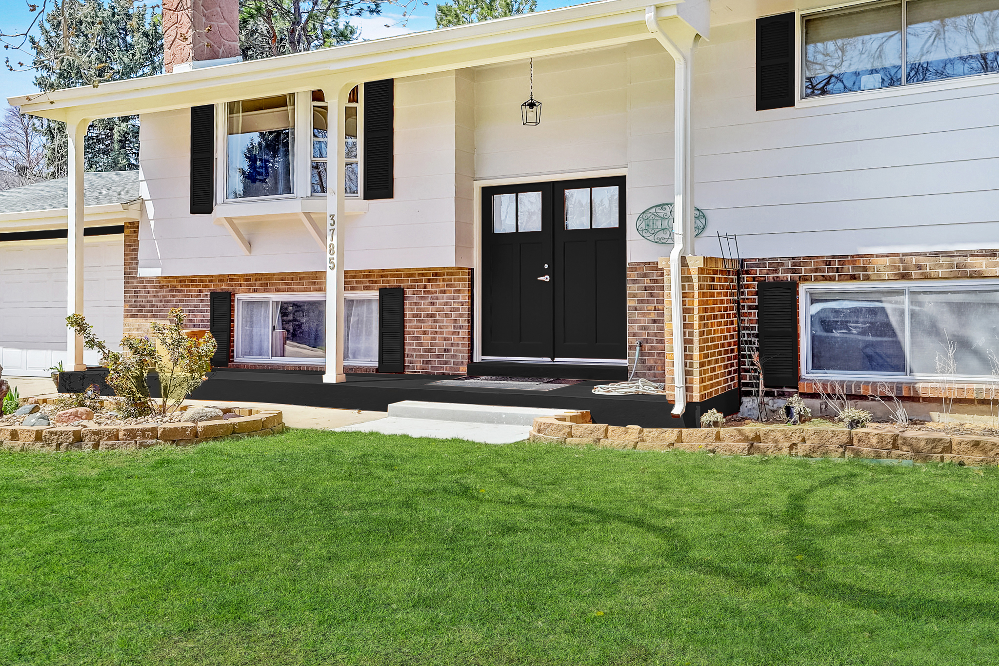 Exterior of 3785 S Benton Way Denver, a staged home for sale with fresh curb appeal and inviting front entry.