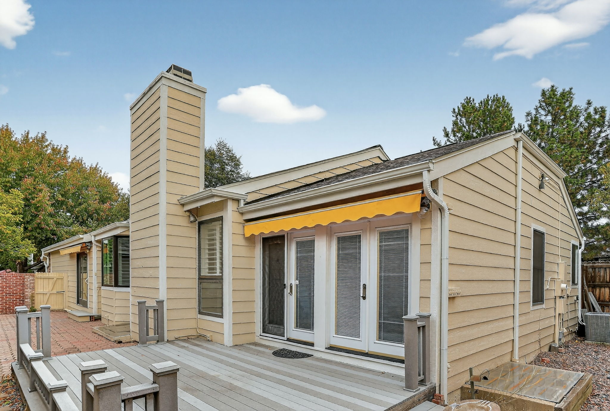 Exterior deck and dual awning of a Low HOA Denver Patio Home at The Ridge at Tamarac