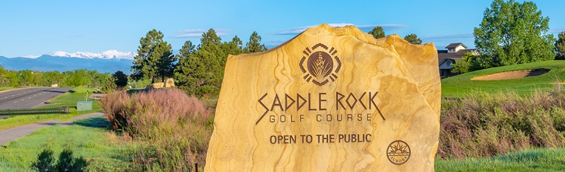 Entrance monument at Saddle Rock Golf Course in Aurora Colorado, representing the community’s golf lifestyle and luxury homes.