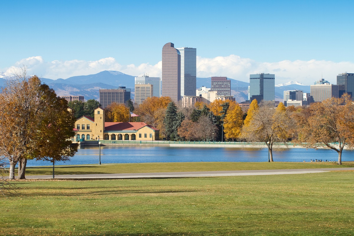 Denver skyline and Rocky Mountains — Colorado real estate by Realtor Donna Jarock